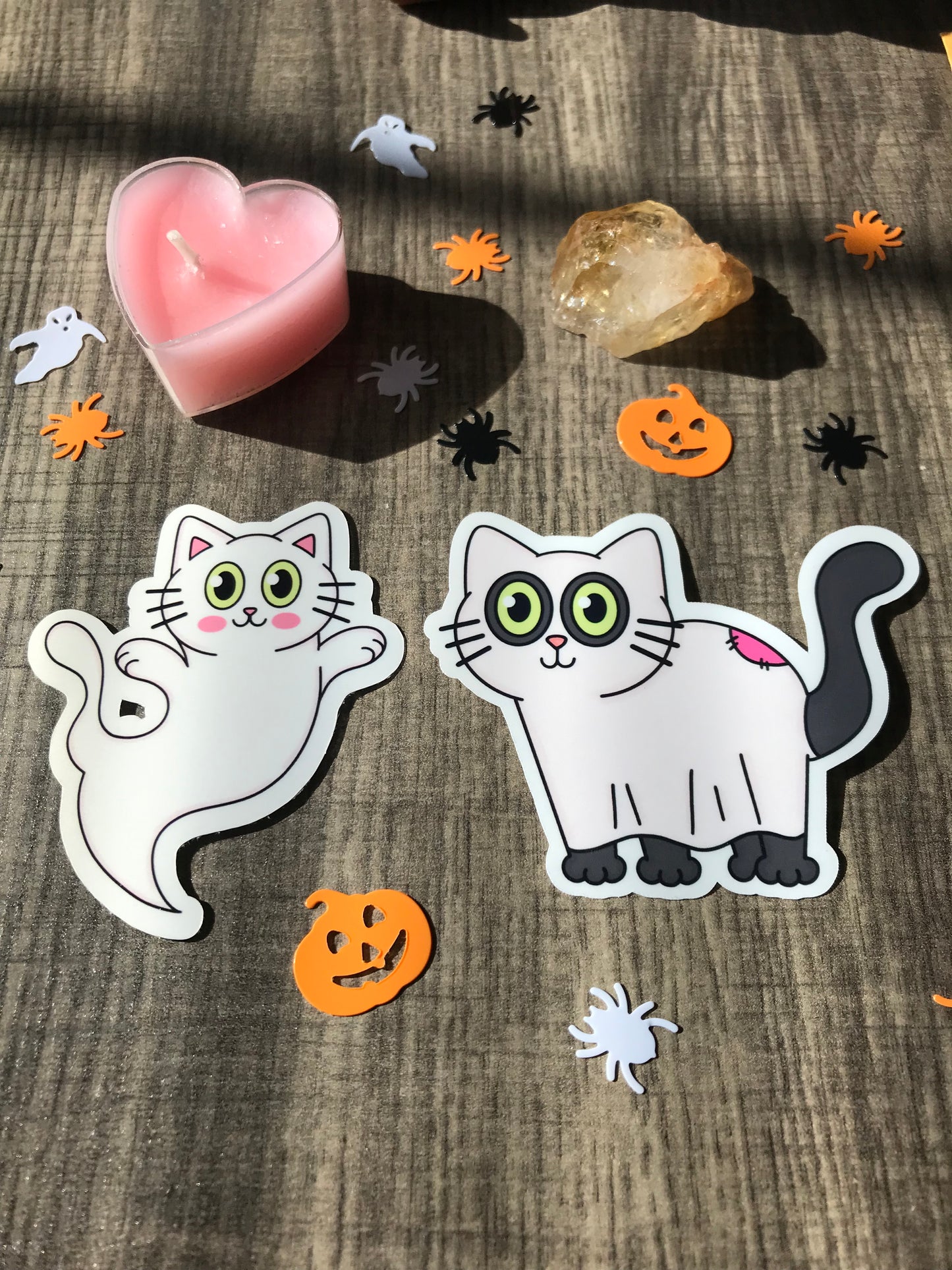 Cat in ghost costume sticker